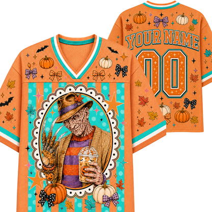 An orange Halloween-themed custom sports jersey shown from the front and back. The jersey features a colorful graphic of a spooky scarecrow in a hat holding a drink, surrounded by pumpkins, autumn leaves, stars, bats, and bows.