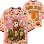 A personalized Halloween-themed sports jersey shown from both front and back. The light peach-pink base is decorated with orange pumpkins, pink and orange bows, autumn leaves, stars, and a central graphic of a hockey mask character in a green jacket and plaid scarf holding a drink.