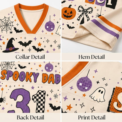 A four-panel close-up collage of a Halloween-themed cream-colored garment, showing the collar detail, hem detail, back detail with 'Spooky Dad 31' text, and a print detail with bats, a pumpkin, a ghost, stars, and orange and purple trim.