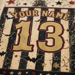 Close-up of a personalized sports jersey design with the text 'YOUR NAME' and the number '13' in a distressed black-and-cream striped pattern with red outlines and decorative stars.