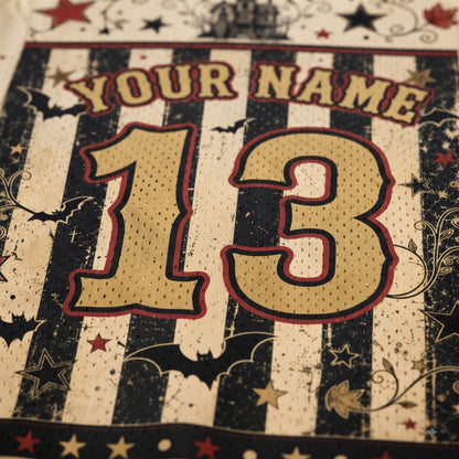Close-up of a personalized sports jersey design with the text 'YOUR NAME' and the number '13' in a distressed black-and-cream striped pattern with red outlines and decorative stars.