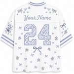 White mesh custom sports jersey shown from the back, featuring a floral patterned number 24, 'Your Name' text, and matching blue and lavender floral prints on the sleeves and shoulders.