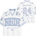 White and light blue custom football-style jersey shown from the front and back, with floral-patterned 'BRIDE' lettering, the number 24, script 'Your Name', and small bow and floral motifs.