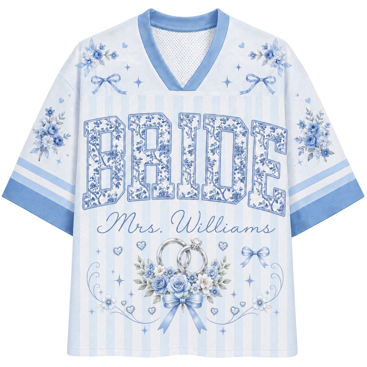 A women's short-sleeve V-neck t-shirt in light blue and white, featuring 'BRIDE Mrs. Williams' printed in floral and script fonts, decorated with wedding rings, flowers, and ribbons.