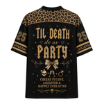 A black short-sleeve t-shirt with a gold graphic print on the back. The design features a leopard print pattern across the shoulders, gold gothic text reading 'TIL DEATH do us PARTY' in the center, a gold bow illustration, a small skull and glasses graphic, and the number '25' on both sleeves.