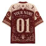 A custom short-sleeve t-shirt with a celestial theme, featuring a dark red and cream print with crescent moons, stars, and the text 'YOUR NAME', 'SAVE THE DAY', and '01'.