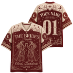 Front and back views of a short-sleeve V-neck jersey shirt in deep burgundy and cream, featuring gothic knight and bride illustrations, stars, crescent moons, and customizable text including 'THE BRIDE'S Knights', 'YOUR NAME', 'SAVE THE DAY', and '01'.