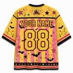 A yellow and pink striped short-sleeve jersey shown from the back, featuring customizable text 'YOUR NAME' and the number '88' in large yellow letters. The design includes black bats, pink and yellow stars, black swirls, a purple castle, and a black top and bottom hem.