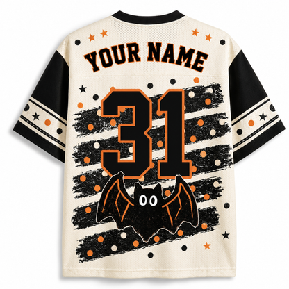 A customizable Halloween-style short-sleeve jersey shown from the back, with black sleeves, a cream mesh body, orange and black stars, stripes, dots, and a bat graphic. The back has placeholder text reading 'YOUR NAME' and a large '31'.