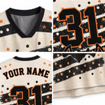 A four-panel close-up collage of a custom hockey-style jersey. The jersey has a cream mesh body with black and orange Halloween-themed graphics, including stars, stripes, polka dots, and the number 31.