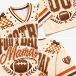 A cream-colored football-themed jersey collage showing multiple close-up views. The design features brown and orange graphics, including the words 'Football Mama,' large lettering, a football motif, stars, laurel leaves, and checkered bow details.
