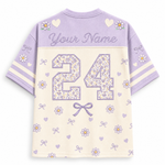 A short-sleeve custom sports jersey shown from the back, featuring a lavender purple upper section with 'Your Name' text and floral heart motifs, and an off-white lower section with a large floral '24' and lavender bows and hearts.
