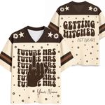 A cream and dark brown custom football-style v-neck t-shirt shown from both front and back. The front features a dark brown graphic of a hand making a peace sign with the word 'FUTURE MRS' repeated, and 'Your Name' printed at the bottom.