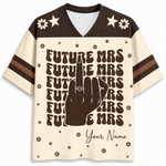 A short-sleeve V-neck t-shirt with a cream and dark brown color-blocked design. The front features a large graphic of a hand making a peace sign with the ring finger raised, surrounded by the text 'FUTURE MRS' repeated in a retro font, with 'Your Name' written at the bottom.