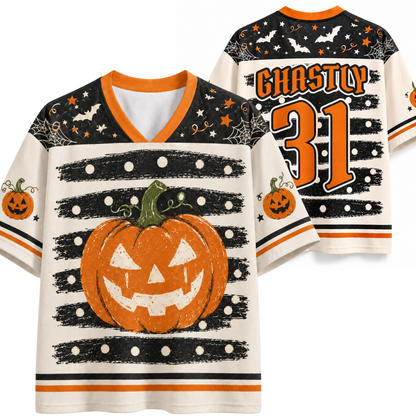 A Halloween-themed football-style jersey shown from both front and back. The jersey has a cream base with orange and black graphics, including a large jack-o'-lantern on the front, black-and-white horizontal stripes, spiderwebs, bats, stars, and the text 'GHOSTLY 31' on the back.