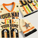 A four-panel product collage showing a customizable hockey-style jersey in a Halloween theme. The jersey has a cream mesh base with orange trim, black and orange striped numbers, ghost graphics, bats, stars, and checkered accents.