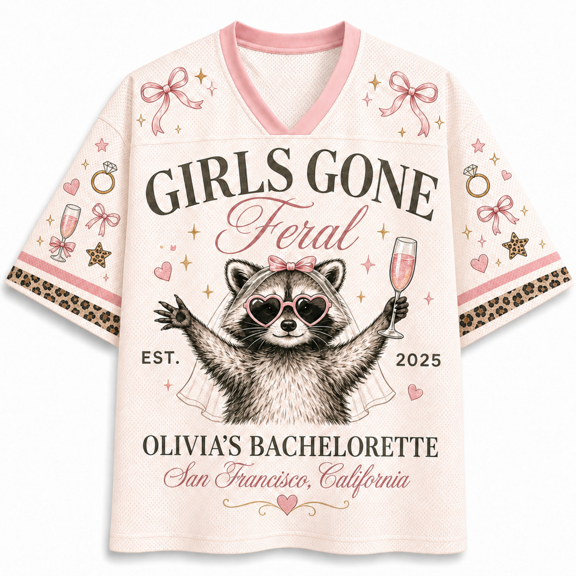 A women's short-sleeve V-neck t-shirt in a light pink mesh fabric, featuring a bachelorette-themed graphic print of a raccoon wearing heart-shaped sunglasses and holding a champagne glass. The text reads 'GIRLS GONE Feral', 'OLIVIA'S BACHELORETTED', 'San Francisco, California', and 'EST.