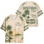 A cream-colored V-neck t-shirt with a tropical Hawaii theme, shown in both front and back views. The shirt features green palm trees, a sunset over the ocean, two beach chairs, and text reading 'HONEYMOON Club' and 'Mrs.