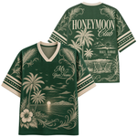A dark green short-sleeve V-neck t-shirt with cream-colored tropical graphics, shown in both front and back views. The back features 'HONEYMOON Club' and 'MAUI, HAWAII EST.