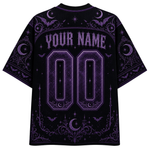 A black short-sleeve t-shirt with a purple gothic-themed graphic print on the back, featuring customizable text 'YOUR NAME' and '00' in a stylized font with moon, bat, and spiderweb motifs.