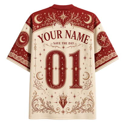 A short-sleeve t-shirt shown from the back, featuring a cream and dark red celestial design with 'YOUR NAME', 'SAVE THE DAY', and the number '01' printed in ornate typography.
