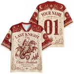 Personalized bachelorette-themed short-sleeve V-neck t-shirt shown from the front and back. The design features a red and cream fantasy illustration of a knight in shining armor riding a dragon, with placeholder text 'YOUR NAME', 'LAST KNIGHT Out', and 'Olivia's Bachelorette' customized for Scottsdale, AZ on June 2026.