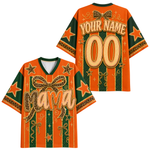 Front and back views of a customizable short-sleeve V-neck jersey shirt. The design features a vibrant orange and dark green striped pattern with leopard-print bows, gold glitter-style lettering that reads 'Mama' on the front and 'YOUR NAME 00' on the back, decorated with gold stars.