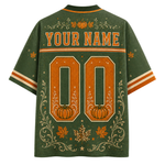 Customizable dark green short-sleeve t-shirt with orange and beige autumn-themed graphics, featuring 'YOUR NAME' and '00' on the back, complete with pumpkins, stars, and fall leaves.