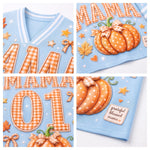 A 2x2 collage showing close-up views of a light blue V-neck top with autumn-themed applique details, including orange gingham lettering, pumpkins with bows, stars, leaves, and a small patch reading 'grateful blessed mama'.