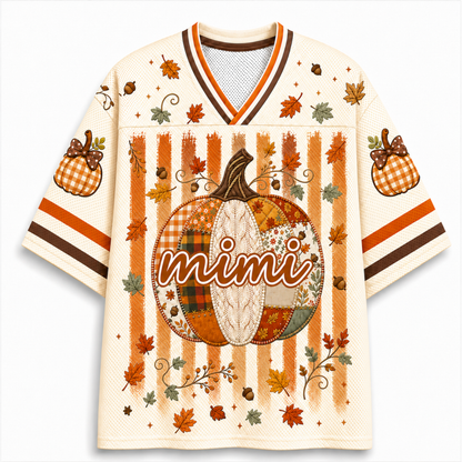 A cream-colored mesh V-neck jersey with an all-over autumn theme, featuring a large patchwork pumpkin with the word 'mimi' across the center, orange and brown vertical stripes, scattered fall leaves, and gingham pumpkin motifs on the sleeves.