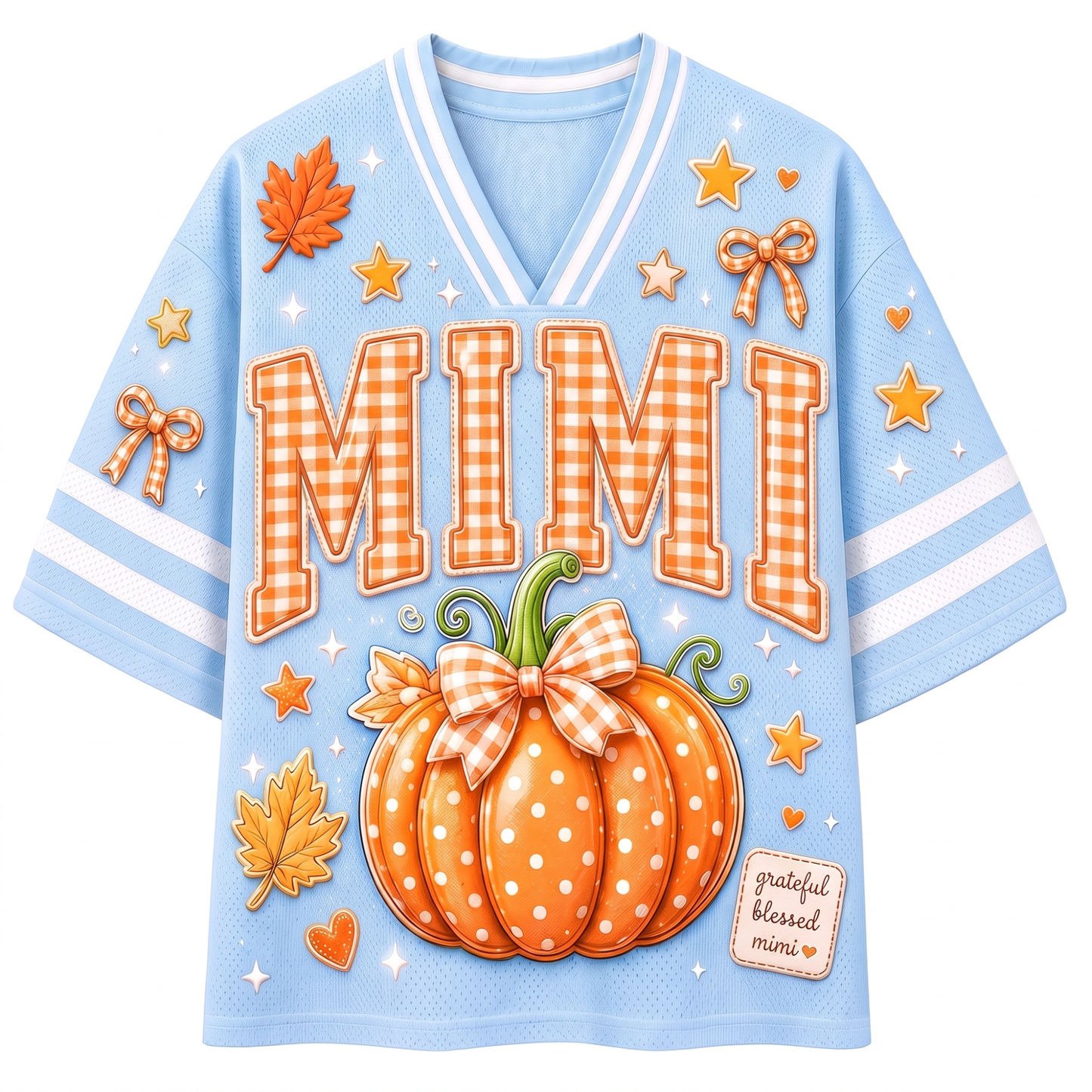 A light blue V-neck short-sleeve shirt with a festive autumn theme. The front features the word 'MIMI' in orange gingham letters, a large orange pumpkin with white polka dots and a matching bow, orange maple leaves, small stars, and a small patch reading 'grateful blessed mimi'.