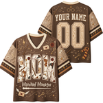 Front and back views of a brown short-sleeve V-neck t-shirt with Harry Potter themed graphics, including 'Mischief Manager' text, wand, key, and owl illustrations, with customizable 'YOUR NAME' and '00' on the back.