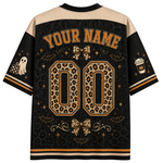 A customizable Halloween-themed short-sleeve jersey shirt shown from the back, featuring a black and beige leopard print pattern, 'YOUR NAME' and '00' placeholders, and spooky graphics like a ghost, coffee cup, and bats.