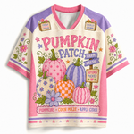 A short-sleeve V-neck graphic t-shirt featuring a colorful autumn pumpkin design with the text 'Pumpkin Patch Farm Fresh' and 'Pumpkins • Corn Maze • Apple Cider'. The shirt has a cream base with pink and purple sleeves and shoulders, decorated with floral and pumpkin motifs.