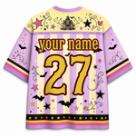 Custom Halloween-themed short-sleeve jersey shirt shown from the back, featuring a lavender and cream striped body with 'your name' and the number '27' in yellow, black, and red. The design includes bats, stars, swirls, a castle, and pink and yellow accents.