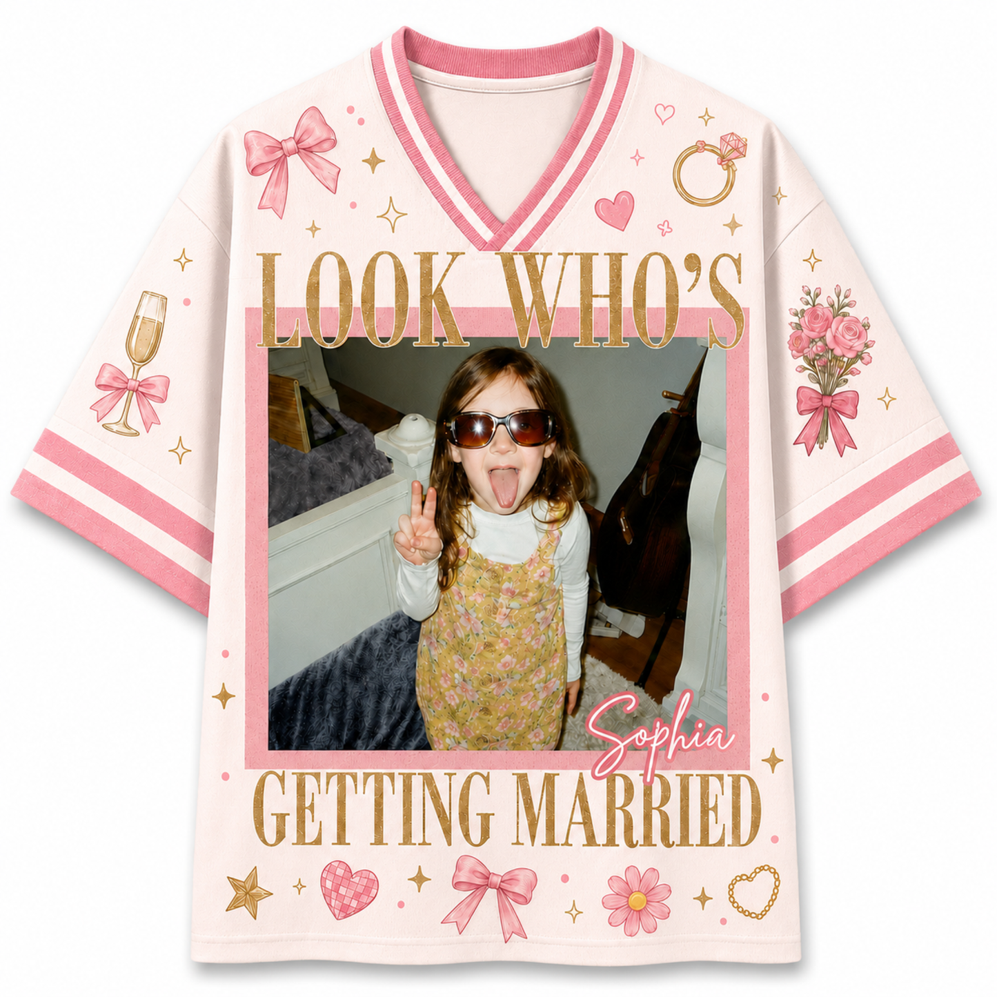 A custom short-sleeve V-neck t-shirt with pink and white stripes, featuring a customizable photo frame in the center with the text 'LOOK WHO'S Sophia GETTING MARRIED' in gold, decorated with pink bows, hearts, and flowers.
