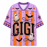 A purple and orange Halloween-themed V-neck jersey shirt with 'GIGI' printed across the front, decorated with ghosts, bats, stars, and bows.
