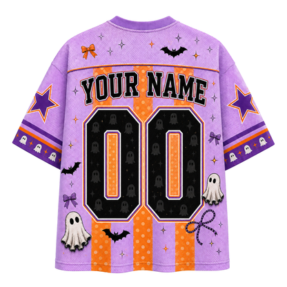 A purple and orange Halloween-themed custom sports jersey shown from the back, featuring 'YOUR NAME' and the number '00' with ghost, bat, and star graphics.