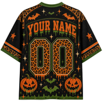 A black short-sleeve t-shirt with a Halloween-themed custom print, featuring orange leopard-print numbers, 'YOUR NAME' text, pumpkins, bats, stars, and green trim.