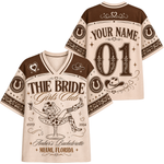 A custom bachelorette-themed short-sleeve V-neck jersey shirt shown from both front and back. The design features a cream and brown color scheme with western motifs, including horseshoes, cowboy hats, a martini glass with a skull and crossed legs, and customizable text fields 'YOUR NAME' and '01' on the back.