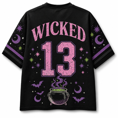 A cream-colored V-neck athletic jersey with orange and black trim, featuring a large graphic of Frankenstein's monster holding a pumpkin cup, surrounded by autumn leaves, pumpkins, stars, and bows.