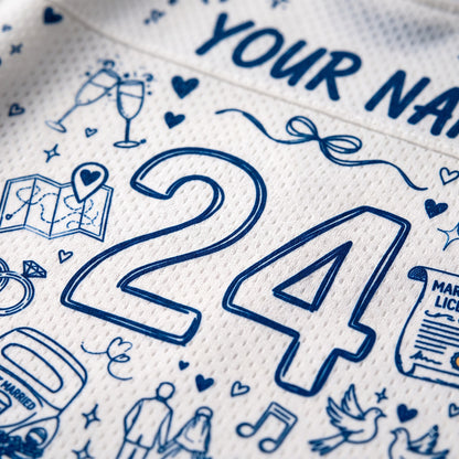 Close-up of a white textured sports jersey with blue line-art illustrations and the number 24, including small wedding-themed doodles and partial custom text reading 'YOUR NA.