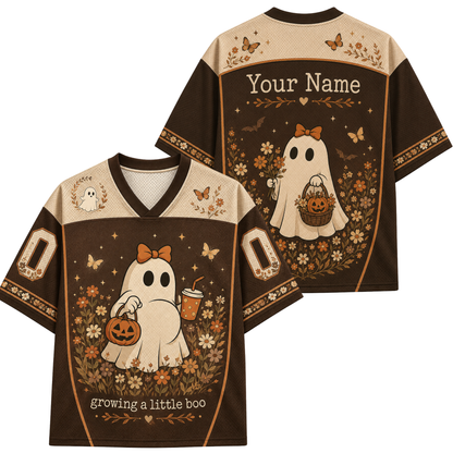 A custom football-style jersey shown from the front and back, featuring a brown and beige color scheme with a cartoon ghost holding a pumpkin and cup, surrounded by flowers and butterflies. The back has a placeholder text 'Your Name' and the front has 'Growing a little boo'.