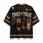 A black short-sleeve t-shirt with a distressed Halloween graphic print featuring the words 'TRICK OR TREAT' and horror-themed motifs like skulls, bats, a hockey mask, and a pumpkin on sticks, shown against a plain white background.
