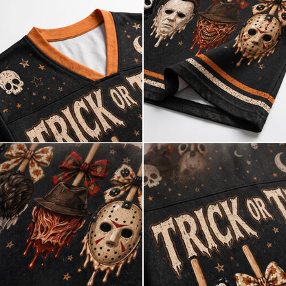 A four-panel close-up collage of a black V-neck graphic T-shirt. The shirt features horror-themed prints including Michael Myers masks, a skull, a witch hat with dripping blood, a bow, and the text 'TRICK OR T.