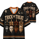 Black short-sleeve V-neck t-shirt with orange trim, featuring a 'Trick or Treat' Halloween graphic with multiple character masks and bows. A second view of the back of the shirt is shown behind it on a white background.