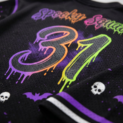 Close-up of a black mesh jersey with colorful dripping neon graphics reading 'Spooky Squad 31', plus purple bat and skull details.