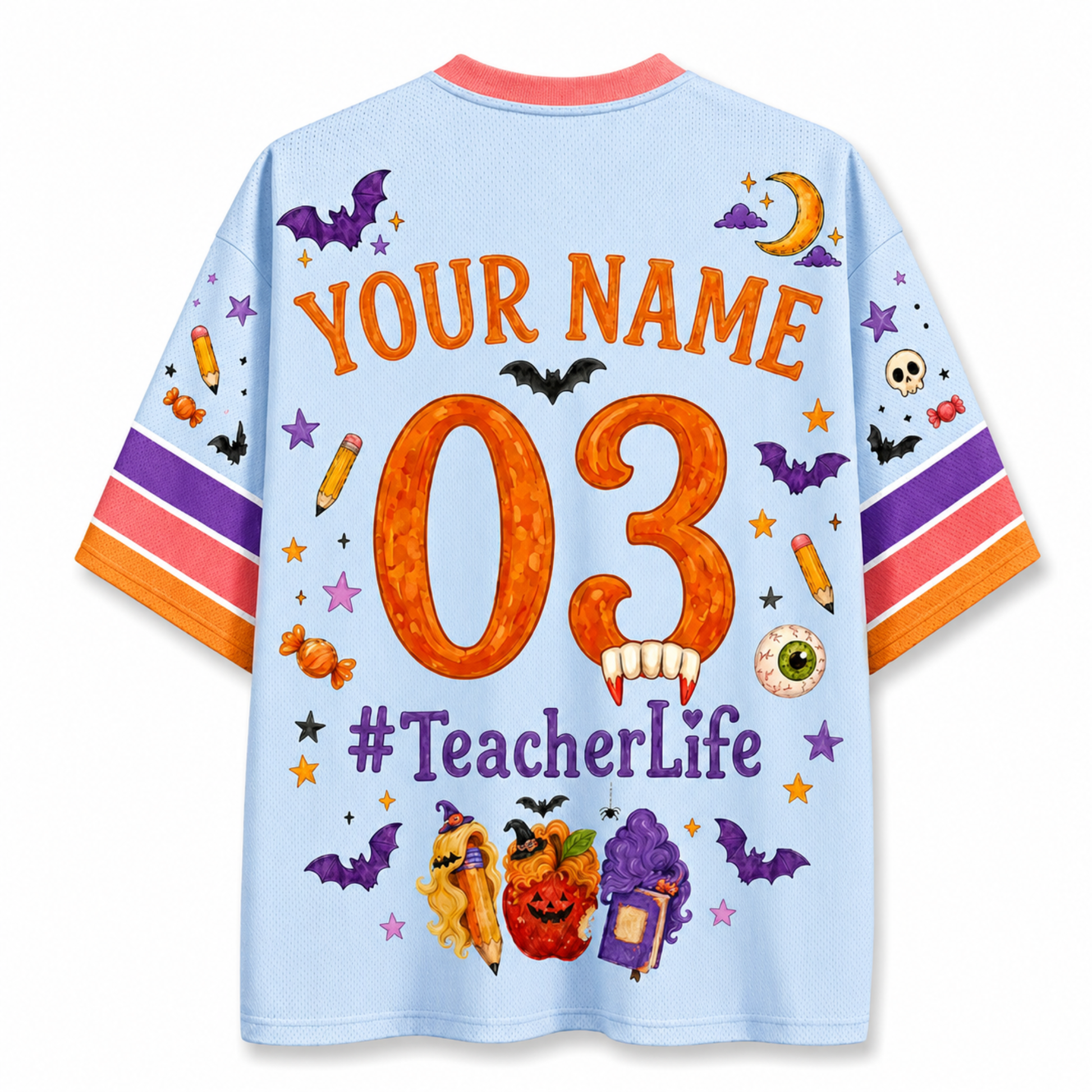 A light blue short-sleeve t-shirt with a colorful Halloween-themed back graphic. The design features the text 'YOUR NAME 03 #TeacherLife' in orange and purple, surrounded by illustrations of bats, pumpkins, candy corn, a witch hat, and stars.