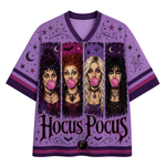 A purple short-sleeve V-neck t-shirt featuring a 'Hocus Pocus' witch graphic print on the front, displayed against a solid white background.