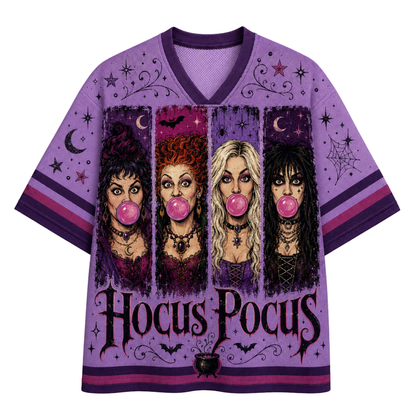 A purple short-sleeve V-neck t-shirt featuring a 'Hocus Pocus' witch graphic print on the front, displayed against a solid white background.